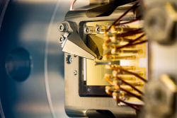 Monolithic ion trap for experiments with 2 dimensional ion crystals