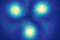 Three yellow dots on a blue background