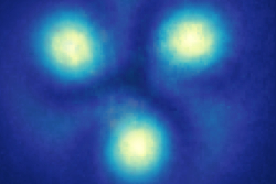 Three yellow dots on a blue background